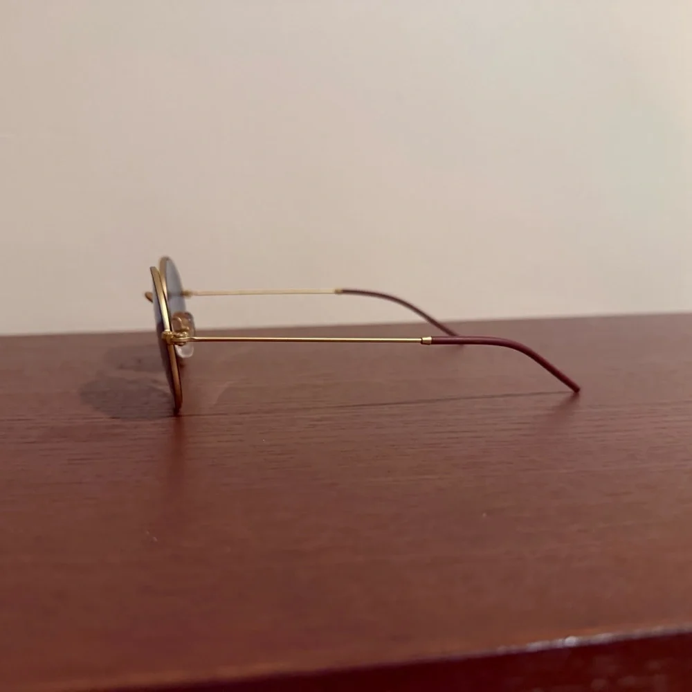 Ray-Ban Gold Frame Sunglasses with Black Lenses